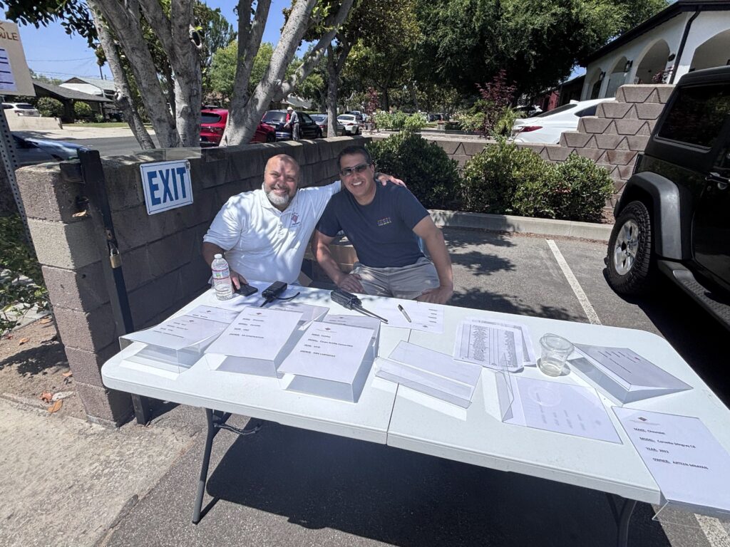 Bro. Boghos Patatian and Bro. Ara Malazian at the Check In table